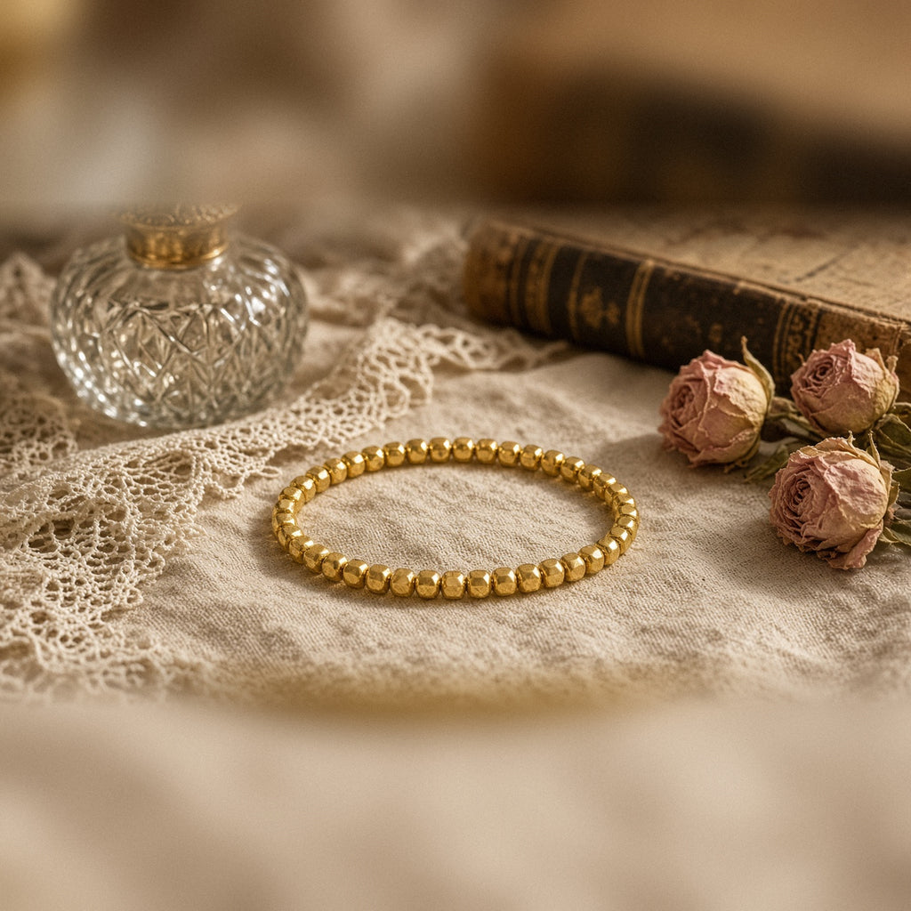 Gold-tone cube bead stretch bracelet on linen and lace with dried roses