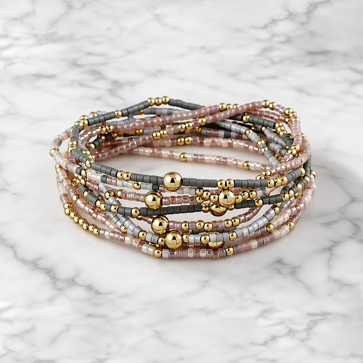 Blush and Gold Bracelet Stack on white marble