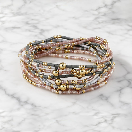 Blush and Gold Bracelet Stack on white marble