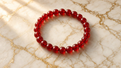 Candy Apple Chunky Bead Bracelet on cream marble with gold veining