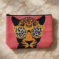 Pink zipper pouch with leopard in yellow sunglasses print, on cream and gold marble