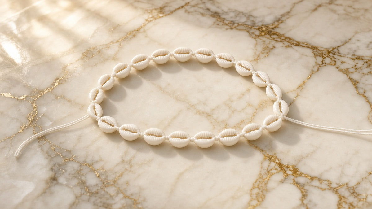 Ivory Cowrie Necklace on cream marble with gold veining