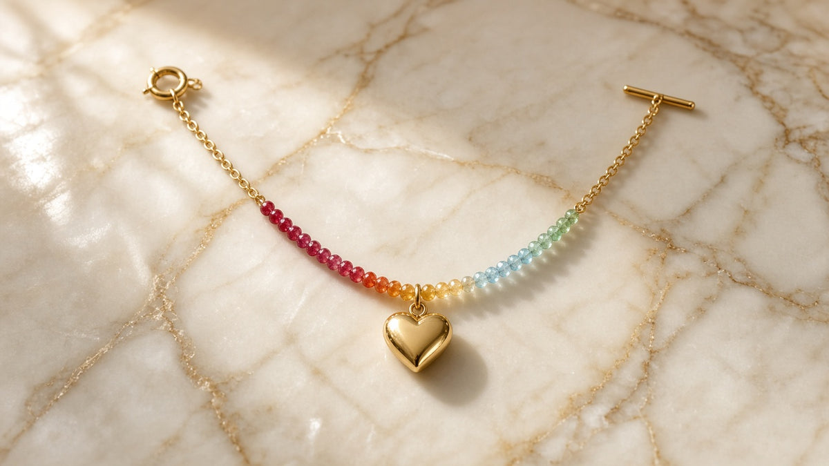 Palette Heart | Rainbow Bead Necklace with Gold Charm on cream marble with gold veining