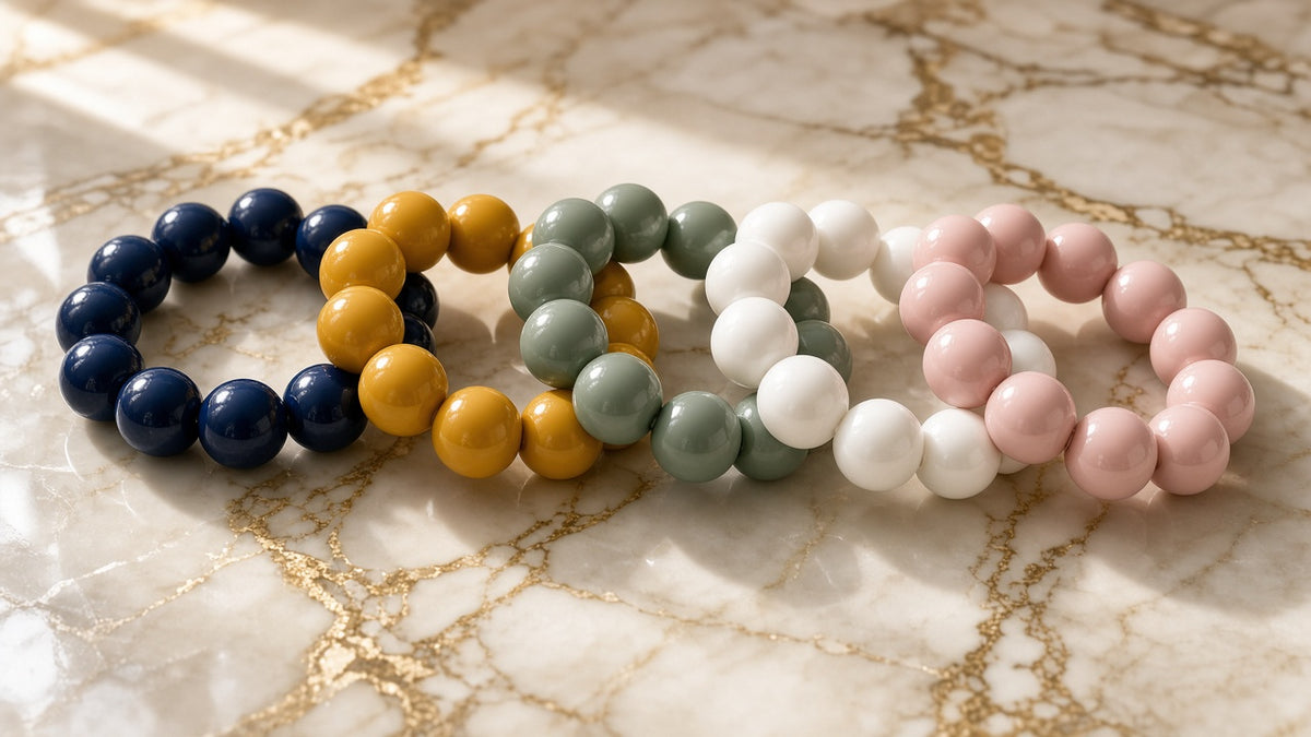 Color Block Chunky Bead Bracelets in assorted colors on cream marble with gold veining