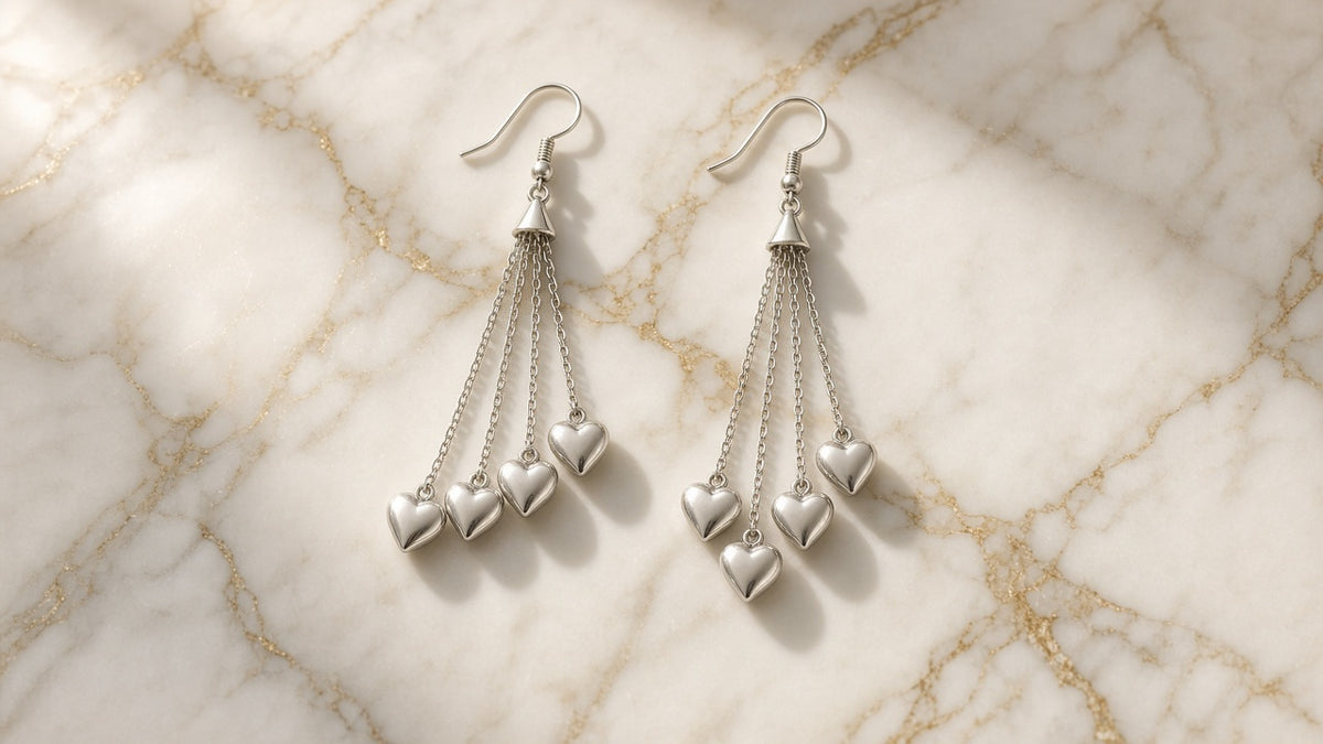 Heartstrings Tassel Earrings on cream marble with gold veining