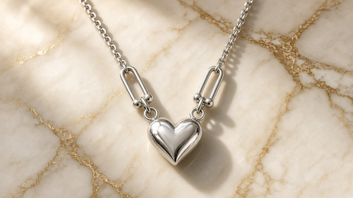 Horseshoe Link Heart Necklace on cream marble with gold veining