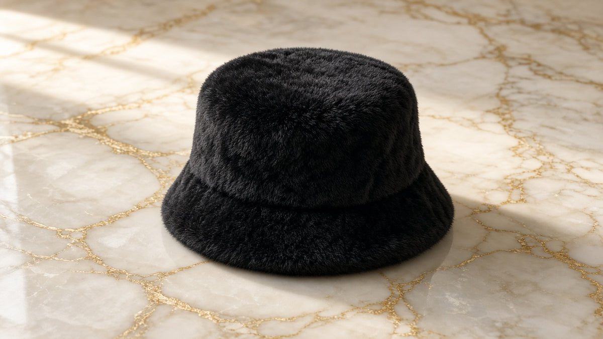 Midnight Black Winter Hat on cream marble with gold veining