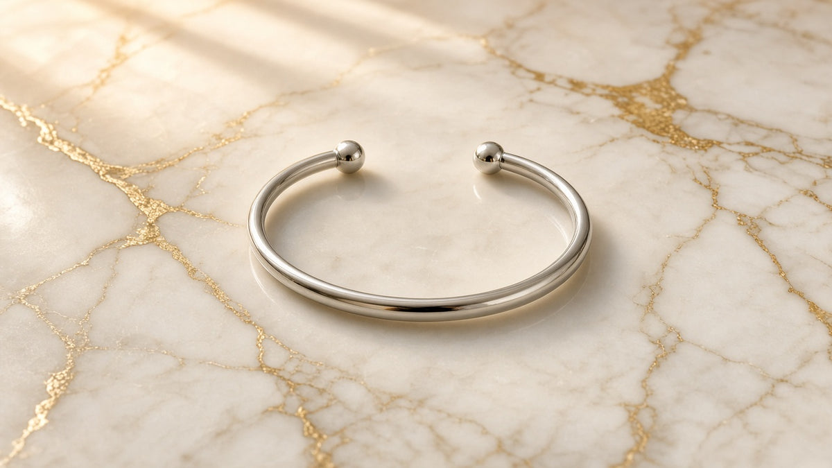 Moonbeam Bead Cuff Bangle on cream marble with gold veining
