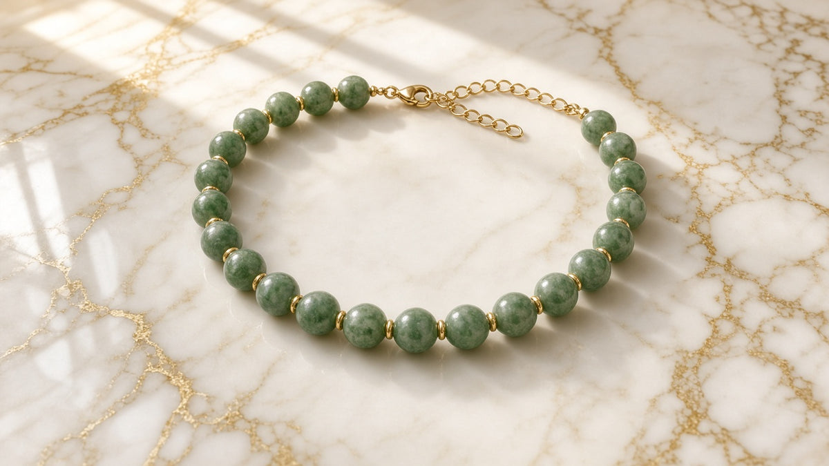 Olive Grove Chunky Bead Necklace on cream marble with gold veining
