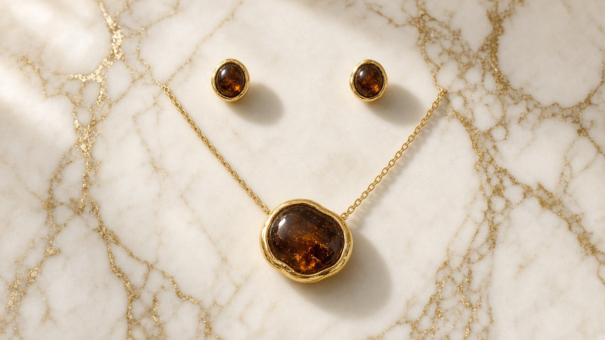 Tawny Stone Pendant and Earring Set on cream marble with gold veining